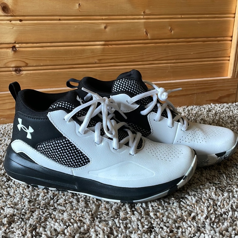 Brand new under armour basketball shoes.  My son wore them once outside.